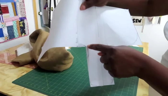 Create a paper pattern based on measurements. Round the corners for a better fit.