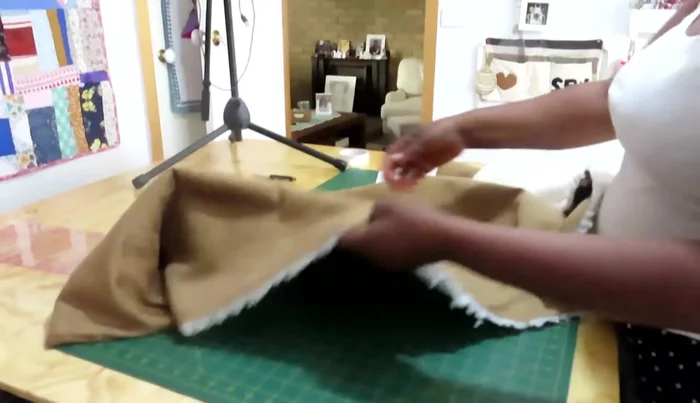 Cut the sherpa fabric using the paper pattern, adding seam allowance (1/2 inch recommended).