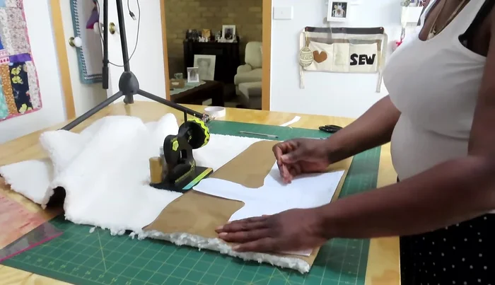 Sew the fabric pieces together using a sewing machine, removing pins as you go.