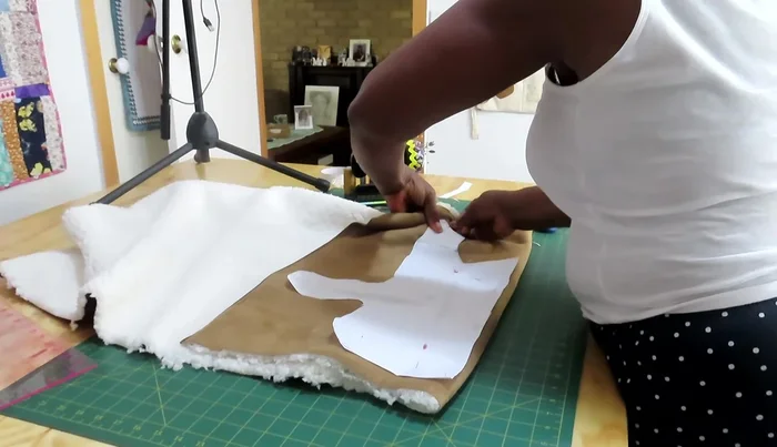 Sew the fabric pieces together using a sewing machine, removing pins as you go.