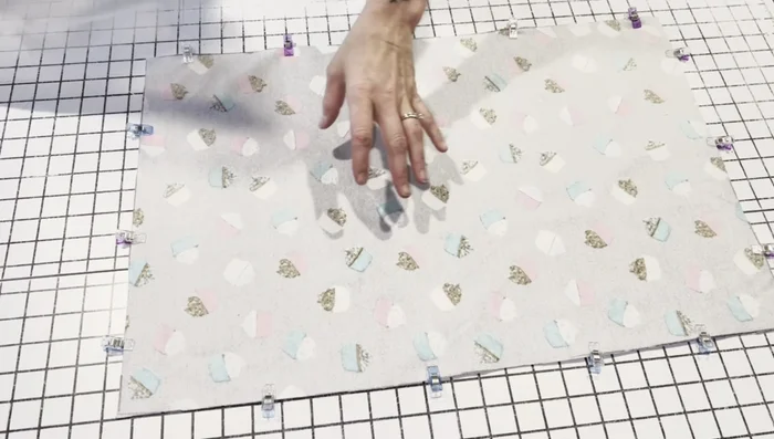 Pin crinkle paper to both sides of the flannel rectangle.