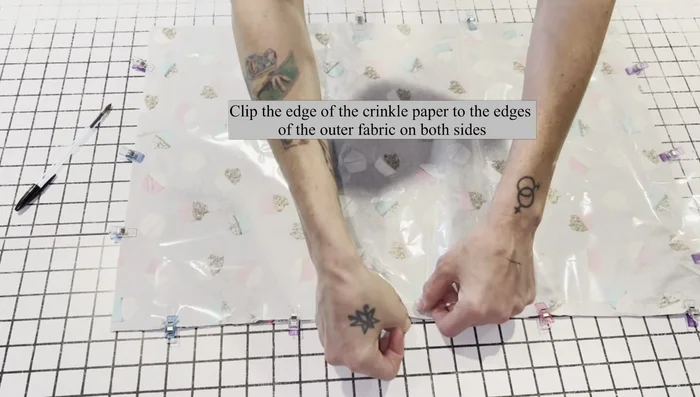 Pin crinkle paper to both sides of the flannel rectangle.