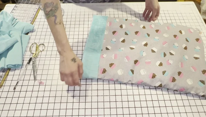 Fold the extra minky/fleece over the top of the flannel sack, enclosing the raw edges. Pin securely.