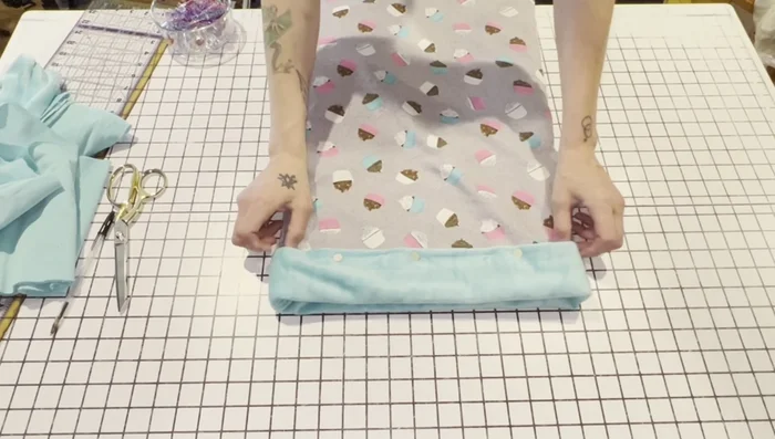 Insert boning through the opening. Stitch across the opening to secure the boning and close the gap. Add an extra stitch line just below the boning to prevent movement.