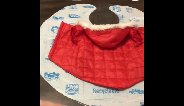 Cut out a hood shape (vase-like or upside-down head shape) that is large enough to fit over your dog's head and neck, leaving space for their nose and ears. Remember to make a fold line for the hood to allow your dog to look up and down.