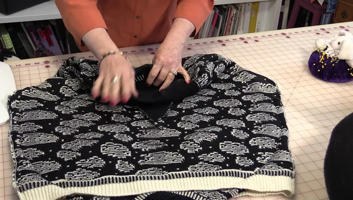 Stitch around the pillow form, creating a half-circle shape. You can hand-sew this step if you prefer.