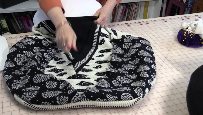 Stitch around the pillow form, creating a half-circle shape. You can hand-sew this step if you prefer.
