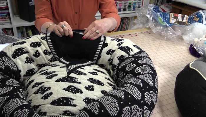 Close the remaining opening (neck area) by hand-sewing. Tuck in excess fabric for a smooth finish.