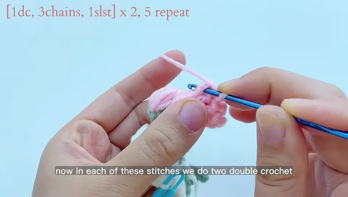 Add flower decorations: Work two double crochets in each of the five stitches on top of the flower clusters. Join with a slip stitch and chain 1.