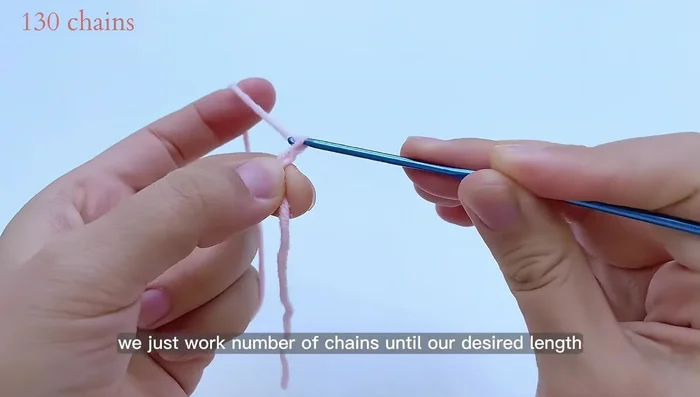 Create the decorative strips: Chain the desired length (130 chains in this example). Attach to the collar using a needle.