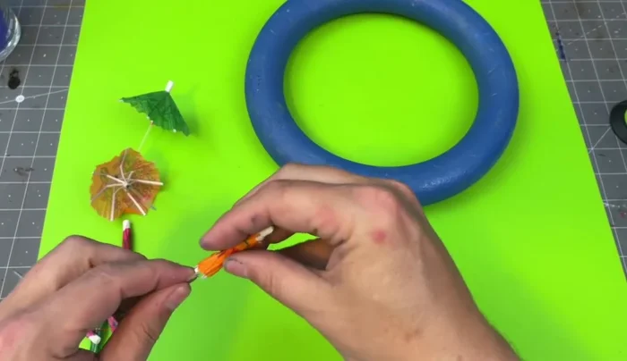 Glue the pool letters to the wreath form.