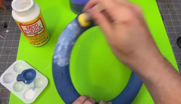 Glue the pool letters to the wreath form.