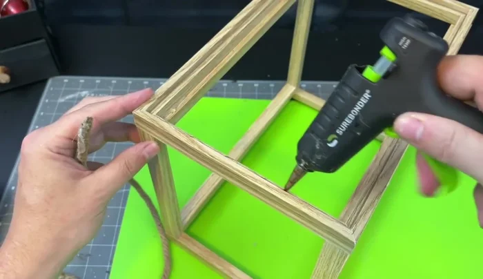 Add nautical rope to the edges of the lantern using hot glue.