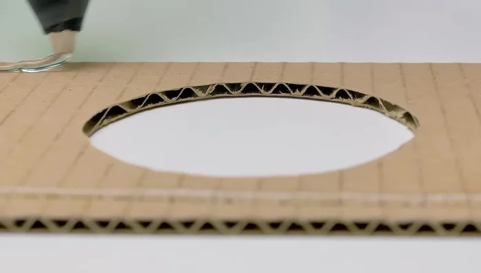 Prepare the water fountain. Make a hole in the bottom of the first bottle and insert the bottleneck of the second bottle. This creates a water reservoir with an outlet.