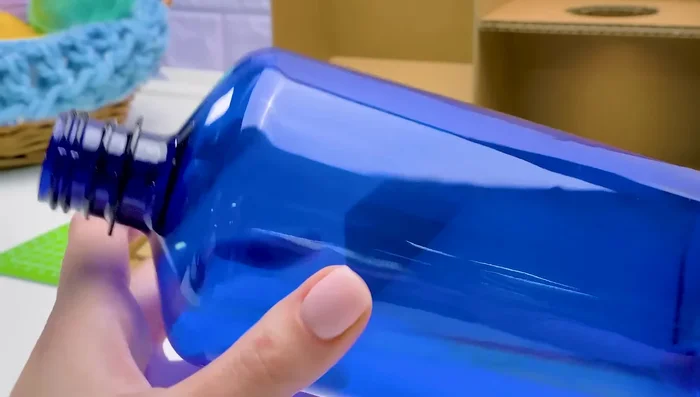 Assemble the water fountain with a tube leading from the second bottle's outlet to the bowl.