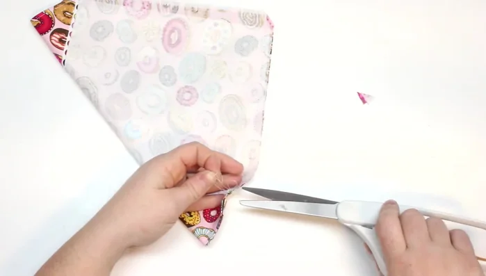 Clip the corner of the scarf tip to create a sharp point.