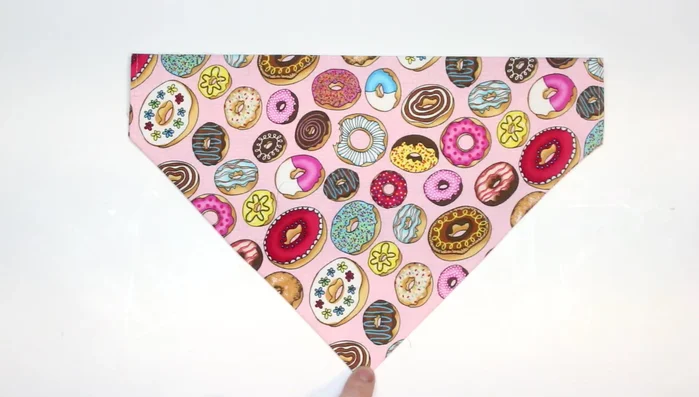 Top stitch along both sides of the triangle and across the top to create a casing for the collar.
