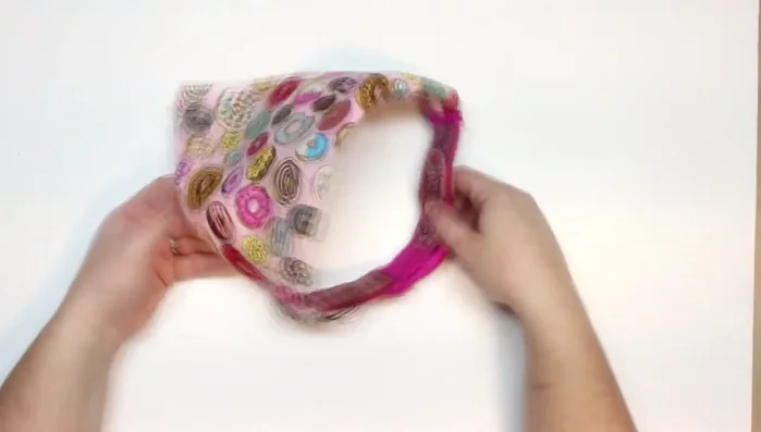 Slip the dog collar through the top opening.