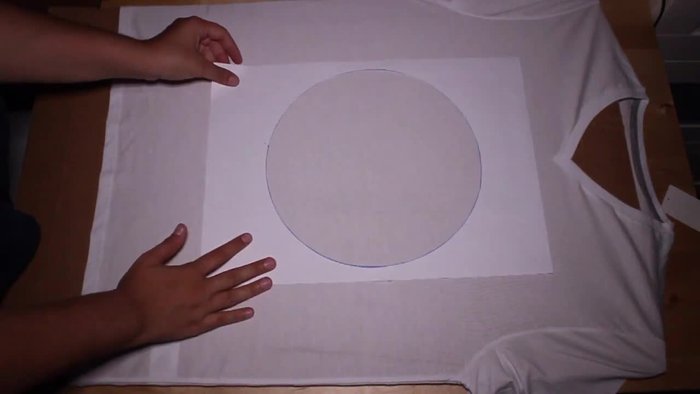 Insert cardboard inside the shirt to keep it flat and protect the back.