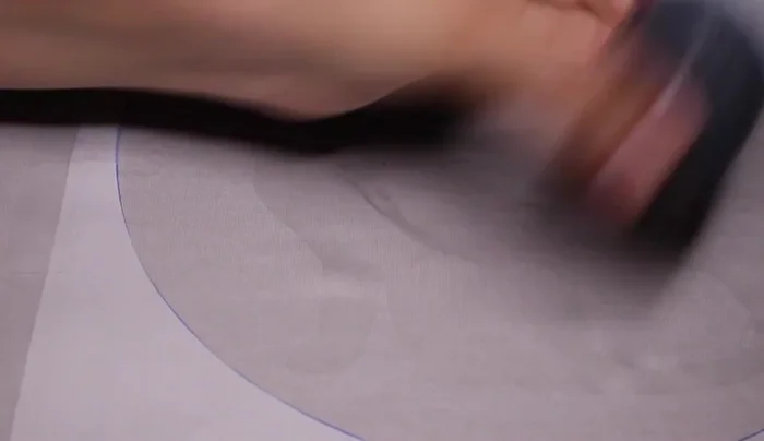 Position the stencil onto the shirt.