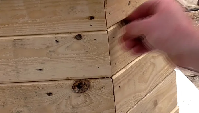 Scrape away excess glue from chamfered edges.