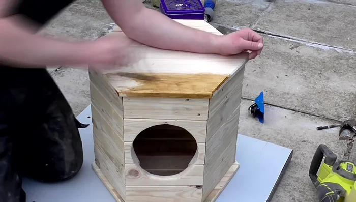 Apply Briwax rustic Pine finish with a brush, buff to a sheen.