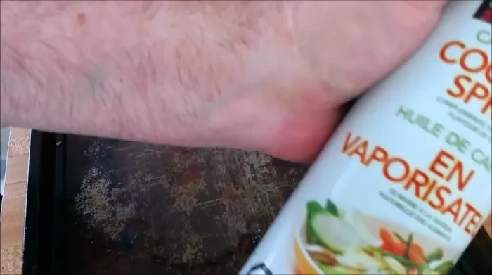 Spray cookie sheet with cooking spray.