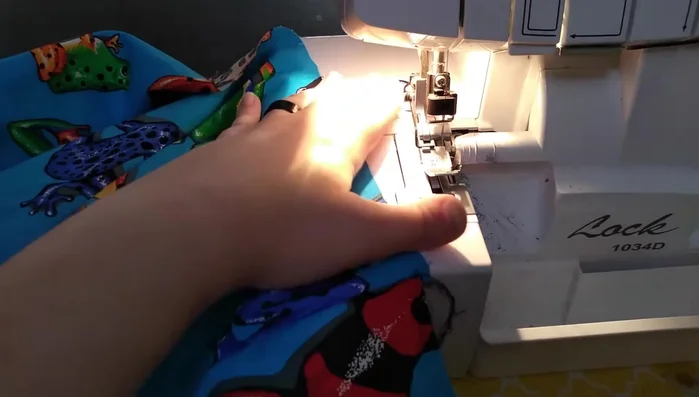 Create a rolled hem on the dress's bottom edge.