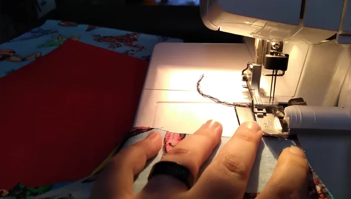 Create casings for elastic on neckline and armholes. A straight seam (after sleeves are attached) makes casing much easier.