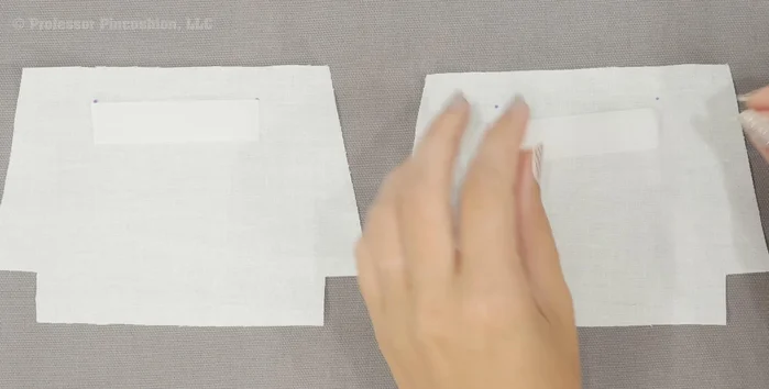 Attach hook and loop. Place hook and loop on the right side of the lining pieces at the marked dots. Sew around the perimeter.