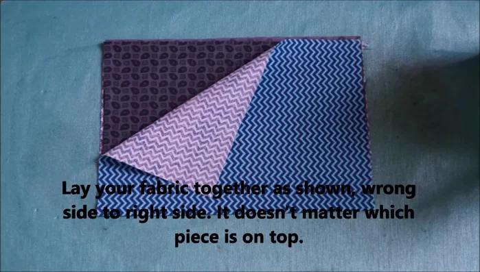 Fold your fabric in half vertically and iron, then in half horizontally and iron again.
