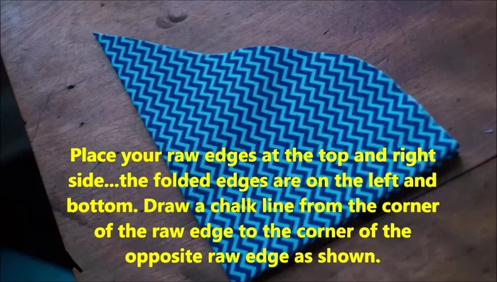 Cut along the chalk line. Open up the fabric pieces.