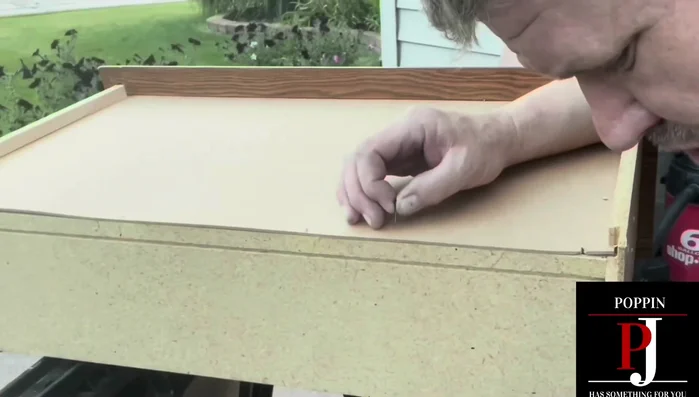 Add extra cedar board reinforcement to the bottom of the drawer.