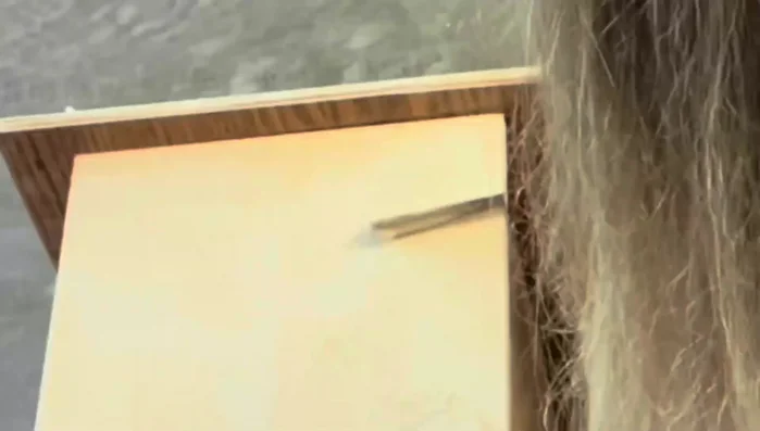 Patch holes from the drawer tracks with wood putty and sand smooth.