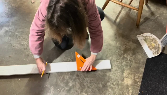 Add extra cedar board reinforcement to the bottom of the drawer.