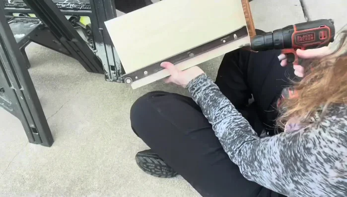 Patch holes from the drawer tracks with wood putty and sand smooth.