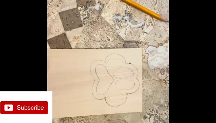 Create and attach a wooden paw design using crackling paint technique.