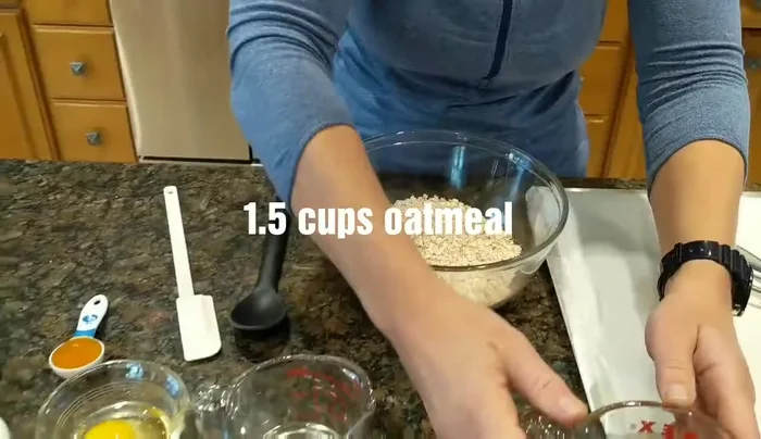 In a bowl, mix 1 1/2 cups oatmeal, 1/4 cup water, 1 egg, and 1/2 cup flour (any kind).