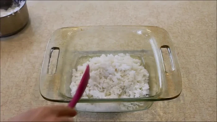 Layer the remaining 1.5 cups of cooked rice on top of the vegetables.