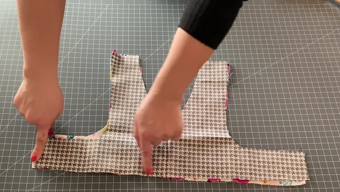 Sew the bodice pieces together. Place the two bodice pieces with right sides together. Sew along the edges, leaving the bottom edge open.