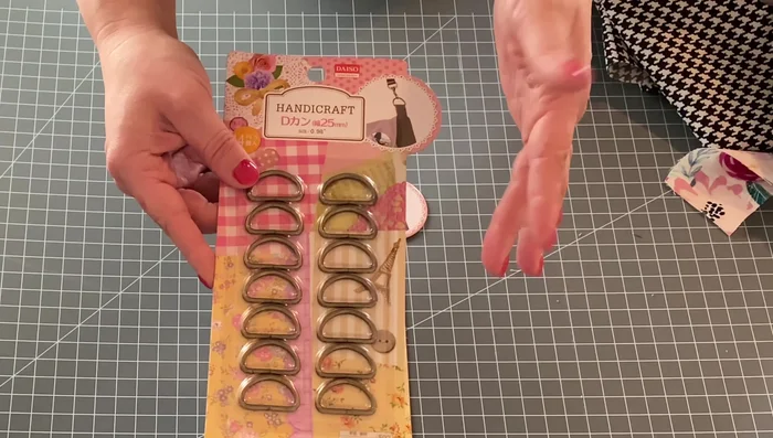 Prepare the decorative strip. Measure and cut a strip of contrasting fabric (approximately 1.5 inches wide and 7 inches long). Fold it in half lengthwise, sew along the long edge, then turn right side out.