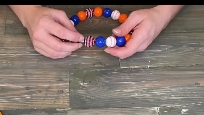 Crimp the sleeve securely, then slide the rubber tubing over the crimp.