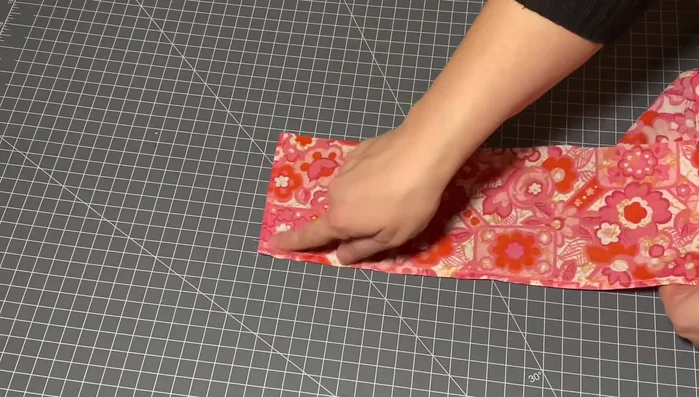 Prepare the skirt: Cut and hem the skirt fabric. Gather the top edge for attaching to the bodice.