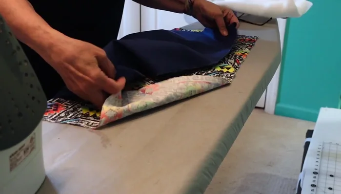 Sew the fabric hammock. Sew the front, back and fleece pieces together, leaving an opening to turn it right-side out. Trim corners and fleece to reduce bulk. Turn right-side out using a chopstick. Press and pin the opening. Then stitch the top opening closed.