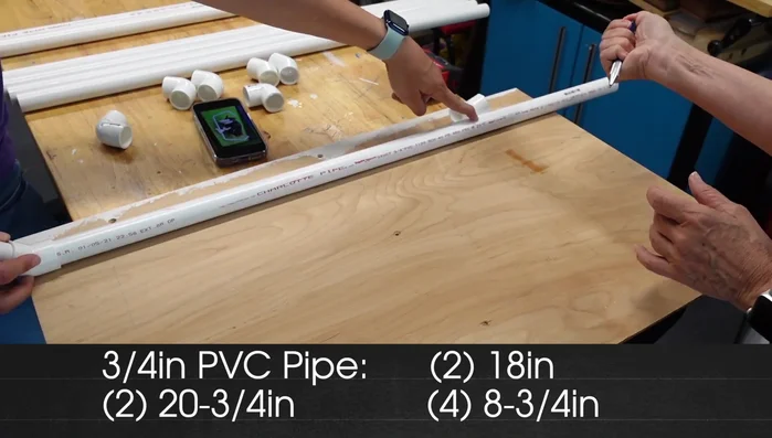Attach screw eyes to each corner of the PVC frame using a drill and a cup hook for faster screwing.