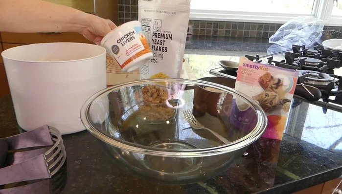 Prepare ingredients: Cooked and mashed chicken livers, cooked rice, nutritional yeast flakes, catnip (optional).