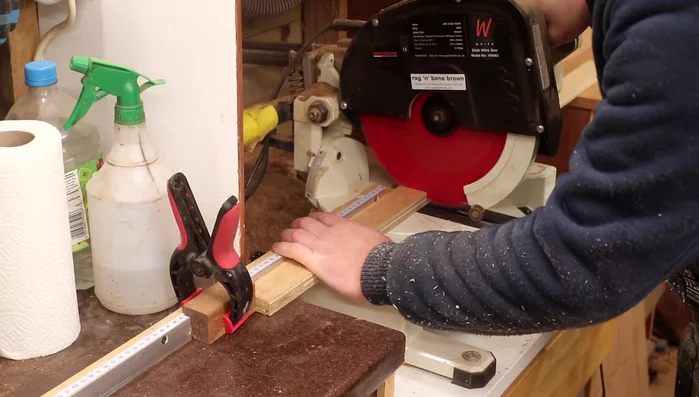 Glue and clamp together the bottom panels, top rails and the previously cut front/back panels.