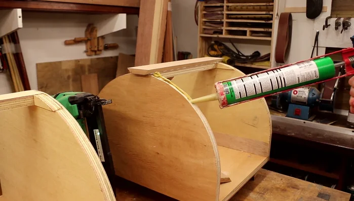 Glue the cladding pieces onto the cat houses using gap-filling adhesive (Grip fill or similar), securing with brads.