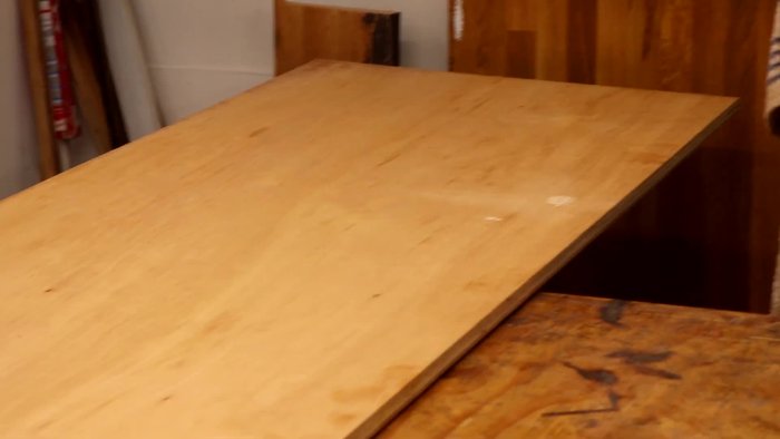 Mark and cut out the arched shapes on the front and back panels simultaneously using a bandsaw for cleaner cuts.