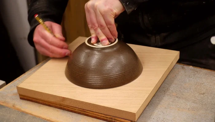 Cut the entrance hole using a router and template, making multiple passes to avoid burning the wood. 